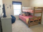 Bedroom with twin top bunk, double bottom bunk, and twin trundle